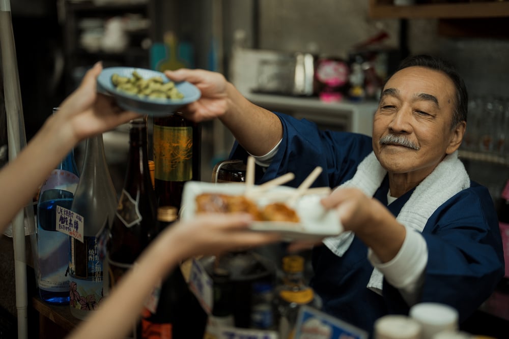 Izakaya Chef Serving Dishes